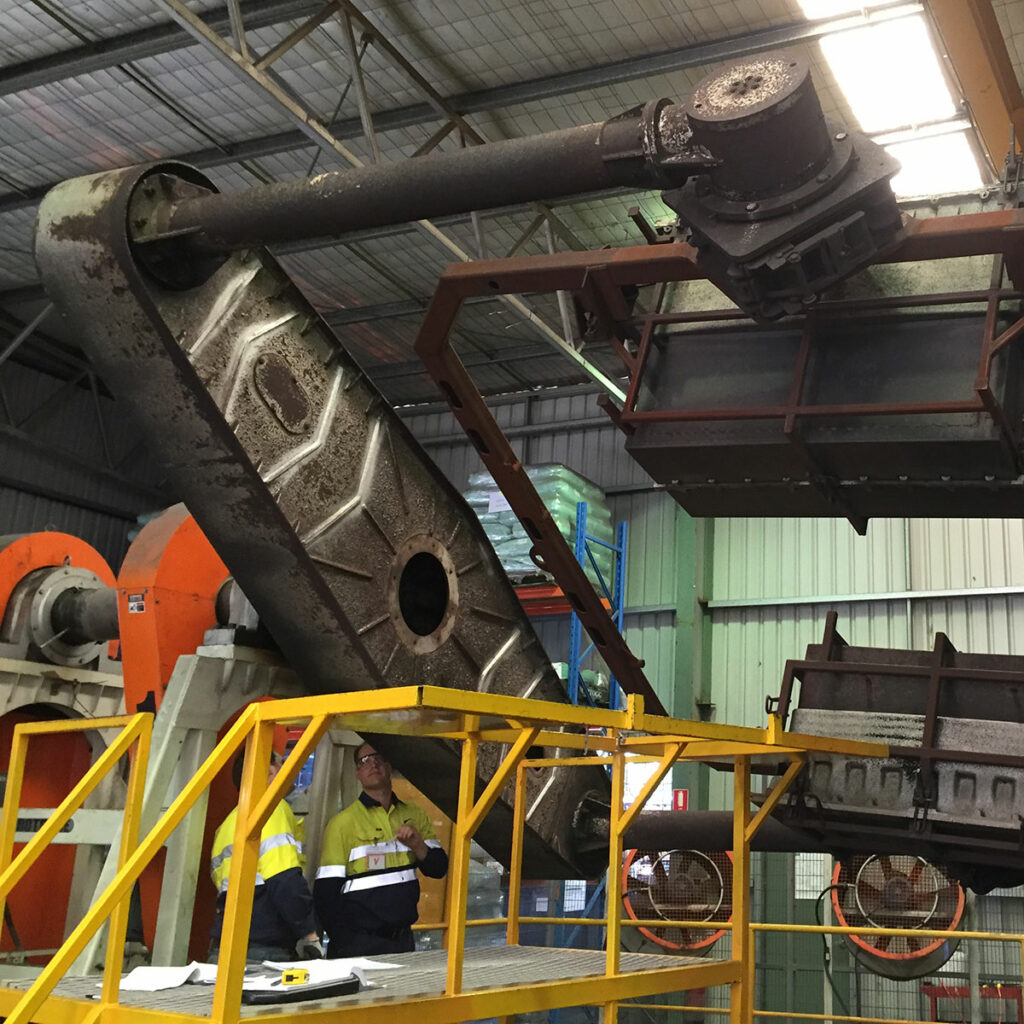 engineers inspecting rotating machinery - mechanical engineering concept