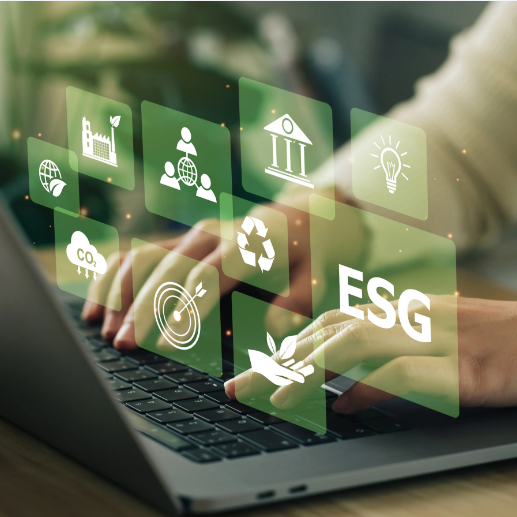 person typing into computer with sustainability icons floating above it